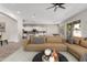 Bright, open-concept living room showcasing modern furnishings and views into kitchen and dining areas at 4215 W Hackamore Dr, Phoenix, AZ 85083