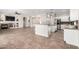 Open living space with fireplace, built-ins, kitchen, and neutral color palette at 4215 W Hackamore Dr, Phoenix, AZ 85083
