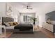 Spacious main bedroom with a ceiling fan, large window, and stylish decor at 4215 W Hackamore Dr, Phoenix, AZ 85083