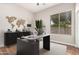 Bright home office with modern desk, stylish decor, and ample natural light at 4215 W Hackamore Dr, Phoenix, AZ 85083