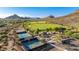 Community park aerial with tennis courts, playground, green spaces, mountain views, and parking at 4215 W Hackamore Dr, Phoenix, AZ 85083