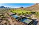 Aerial view of community recreational facilities, showcasing tennis courts, park and playground at 4215 W Hackamore Dr, Phoenix, AZ 85083