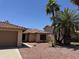 Inviting single-Gathering home with a terracotta tile roof, two car garage, and palm trees at 4301 E Amberwood Dr, Phoenix, AZ 85048