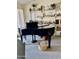 Living room features a grand piano and elegant decor, perfect for entertaining at 4301 E Amberwood Dr, Phoenix, AZ 85048