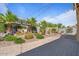 This backyard features a stone fountain, desert landscaping, string lights, and a brick patio at 4426 E Leroy St, Gilbert, AZ 85295