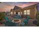 Enjoy a fire in this backyard with seating area, outdoor tv, and manicured landscaping at 4426 E Leroy St, Gilbert, AZ 85295