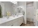 Bright bathroom with double sinks, a large mirror, and a separate shower and tub, offering ample space and convenience at 4426 E Leroy St, Gilbert, AZ 85295