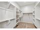 Walk-in closet with shelving and hanging bars at 4426 E Leroy St, Gilbert, AZ 85295