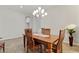 Dining room with tiled floors and chandelier at 4426 E Leroy St, Gilbert, AZ 85295