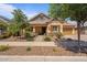 Charming single-story home with desert landscaping, covered porch, and attached two-car garage at 4426 E Leroy St, Gilbert, AZ 85295