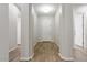Hallway showcasing wood-look tile flooring, modern paint, and bright lighting at 4426 E Leroy St, Gilbert, AZ 85295