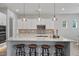 Bright kitchen with granite countertops, modern appliances, and ample seating at the island, perfect for entertaining at 4426 E Leroy St, Gilbert, AZ 85295