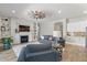 Cozy living room featuring a fireplace, built-in shelves, and comfortable seating, creating an inviting atmosphere at 4426 E Leroy St, Gilbert, AZ 85295