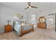 Main bedroom featuring carpet, ceiling fan, and ensuite bathroom at 4426 E Leroy St, Gilbert, AZ 85295