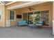 Covered patio with comfortable seating and a ceiling fan at 4426 E Leroy St, Gilbert, AZ 85295