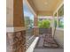 Cozy covered front porch with rocking chairs, and views of neighborhood at 4426 E Leroy St, Gilbert, AZ 85295