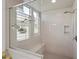 Walk-in shower with clear glass and greenery at 4426 E Leroy St, Gilbert, AZ 85295