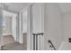 Upstairs hallway featuring carpeted floors and multiple entrances to bedrooms at 4714 E Broadway Rd, Phoenix, AZ 85040