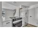 Open concept kitchen with stainless steel appliances and quartz countertops at 4714 E Broadway Rd, Phoenix, AZ 85040
