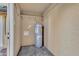 Small utility room containing hot water heater, shelving, and water hookups for laundry at 4714 E Broadway Rd, Phoenix, AZ 85040
