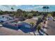 Aerial view of a home with a backyard pool, desert landscaping and a privacy fence at 501 W Jasper Dr, Chandler, AZ 85225
