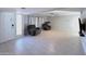 Spacious living area featuring tile flooring, neutral paint, and two cozy recliners at 501 W Jasper Dr, Chandler, AZ 85225