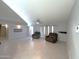 Open living area featuring tile flooring, neutral paint, and two cozy recliners at 501 W Jasper Dr, Chandler, AZ 85225