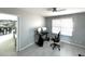 Office space with desk, chair, and view into dining area featuring tile flooring at 501 W Jasper Dr, Chandler, AZ 85225