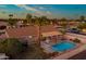 Beautiful backyard view featuring a refreshing private pool, patio area, desert landscaping, and relaxing shaded seating at 501 W Jasper Dr, Chandler, AZ 85225