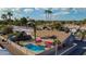 Aerial shot of private backyard oasis with sparkling pool, patio, and lush landscaping, perfect for outdoor entertaining at 501 W Jasper Dr, Chandler, AZ 85225