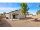 Private backyard with low maintenance landscape, a covered patio, and mature landscaping at 6999 S Blue Hills Dr, Buckeye, AZ 85326