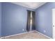 A cozy empty bedroom with carpet, natural light, and neutral paint at 6999 S Blue Hills Dr, Buckeye, AZ 85326