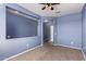 Inviting bedroom area with carpet flooring, neutral decor, and a modern ceiling fan at 6999 S Blue Hills Dr, Buckeye, AZ 85326