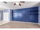 Spacious bedroom with closet access, carpet flooring, and custom built in shelving at 6999 S Blue Hills Dr, Buckeye, AZ 85326