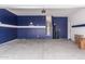 Spacious garage with Dallas Cowboys themed decor, water heater, and plenty of room for storage and parking at 6999 S Blue Hills Dr, Buckeye, AZ 85326