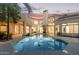 Beautiful backyard with a pool and mature trees, creating a private oasis at 7376 E Via Estrella Ave, Scottsdale, AZ 85258