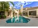 Beautiful backyard featuring a pool and mature trees, providing a sense of privacy and relaxation at 7376 E Via Estrella Ave, Scottsdale, AZ 85258
