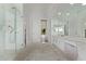 Primary bath with sleek shower, vanity, and marble tile flooring, with an open view to outside at 7376 E Via Estrella Ave, Scottsdale, AZ 85258