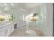 Bright bathroom features a soaking tub, glass enclosed shower and a dual sink vanity at 7376 E Via Estrella Ave, Scottsdale, AZ 85258