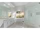 Bright bathroom with modern tub, glass shower, dual sinks, and sleek marble tile at 7376 E Via Estrella Ave, Scottsdale, AZ 85258
