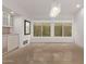 Bright dining room featuring tile floors, modern lighting, and expansive windows at 7376 E Via Estrella Ave, Scottsdale, AZ 85258