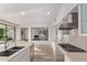 Open concept kitchen with stainless steel appliances and easy access to the living area at 7376 E Via Estrella Ave, Scottsdale, AZ 85258