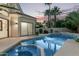 Inviting pool and spa area with lush landscaping, offering a private backyard oasis at 7376 E Via Estrella Ave, Scottsdale, AZ 85258