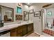 Bathroom featuring framed mirrors above a long vanity, neutral colored floors, and a separate toilet room at 8139 E Club Village Dr, Gold Canyon, AZ 85118