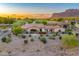 Stunning desert home with a tile roof, lush landscaping, and mountain views at 8139 E Club Village Dr, Gold Canyon, AZ 85118