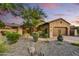 Charming desert home with a private drive, beautiful plants, and an attached garage at 8139 E Club Village Dr, Gold Canyon, AZ 85118