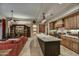 Stylish kitchen with a large island, stainless steel appliances, and a connected living room area at 8139 E Club Village Dr, Gold Canyon, AZ 85118