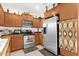 Well-equipped kitchen with stainless steel appliances, ample cabinet space, and tile flooring at 8429 W Vernon Ave, Phoenix, AZ 85037