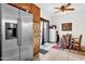 Bright kitchen and dining area showcasing stainless steel appliances and outdoor access at 8429 W Vernon Ave, Phoenix, AZ 85037