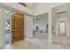 Grand foyer with marble floors, high ceilings, and a view of the spacious living room at 9 E Los Arboles Cir, Tempe, AZ 85284
